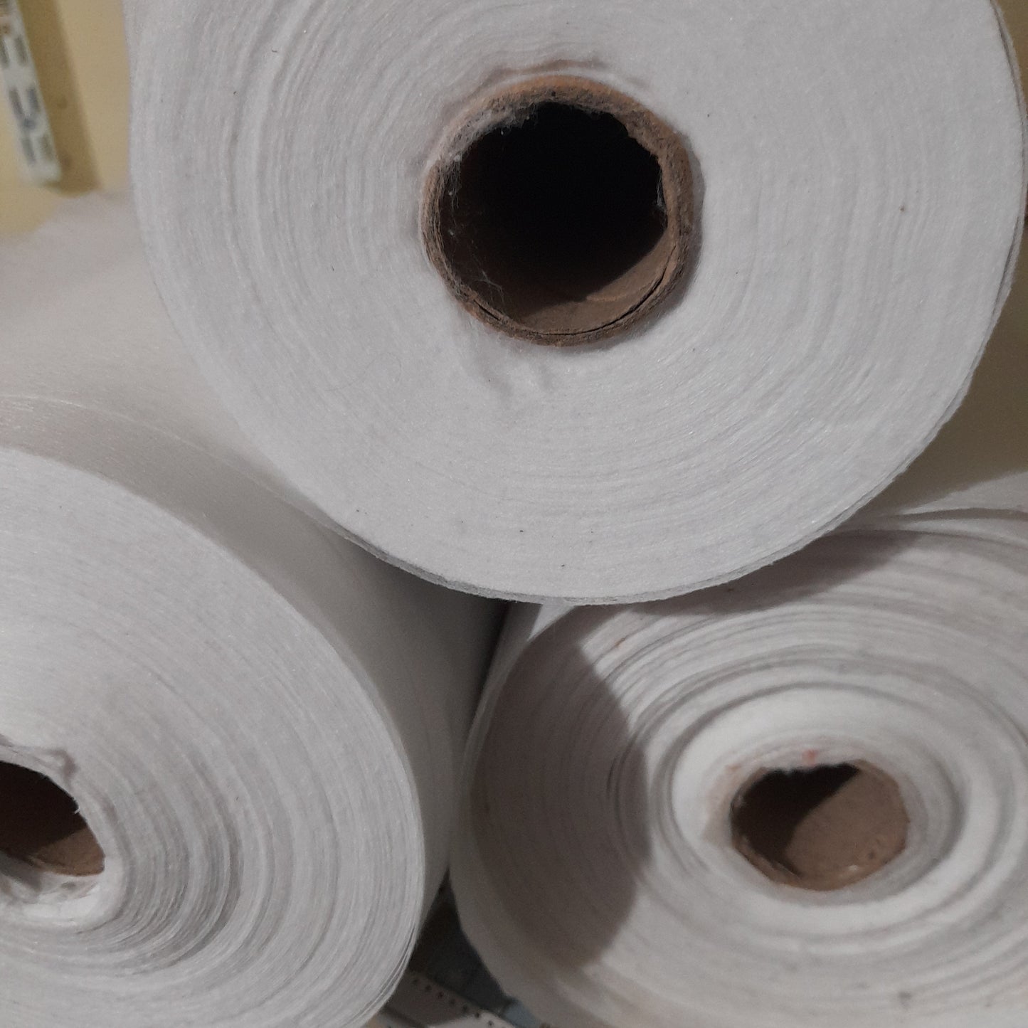 Fusible interfacing , sold by the metre .